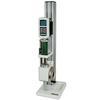 The TSF vertical test stand is shown in a compression spring testing application with Series M5-1000 digital force gauge, compression plate, and optional digital travel display.