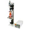 The TSTM-DC vertical advanced motorized torque test stand is shown in a typical bottle cap torque testing application with 5i force/torque indicator, Series R50 torque sensor, and grips.