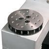 Rotating mounting plate contains a matrix of threaded holes for grip and fixture mounting.