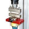 Optional axial compensator allows for vertical movement in the sample during a torque test.