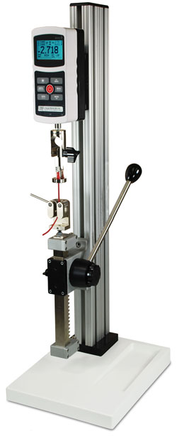 The TSA750 is shown in a typical wire terminal pull testing application with Series 5 digital force gauge, G1001 wire terminal grip, and G1002 dual roller grip.